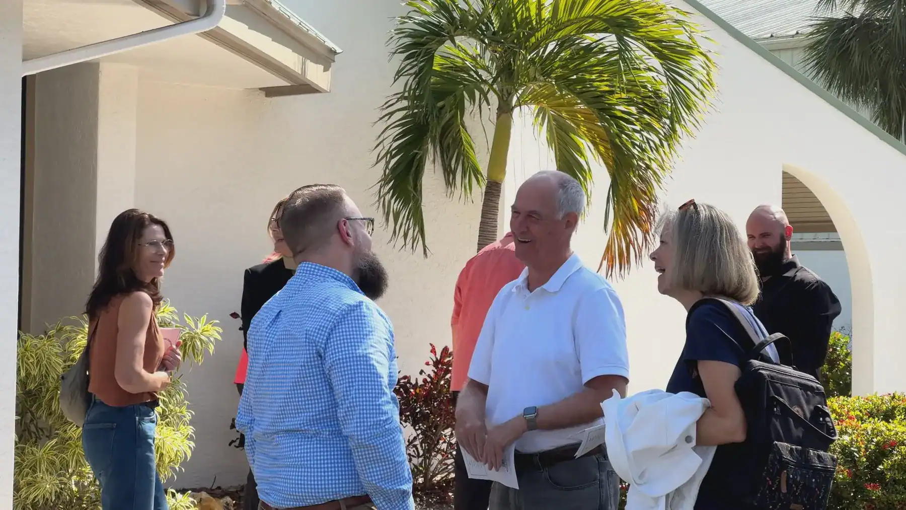 Westminster members sharing conversation and fellowship outside the church